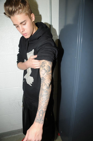 Illustration for article titled Justin Bieber's Tattoos Documented by the Miami PD: A Visual Analysis